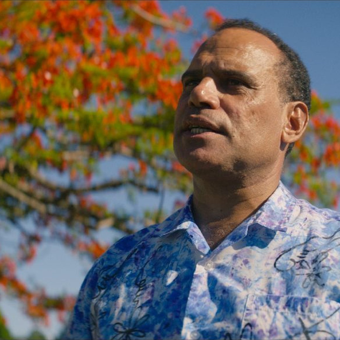 Ralph Regenvanu beneath a flowering tree