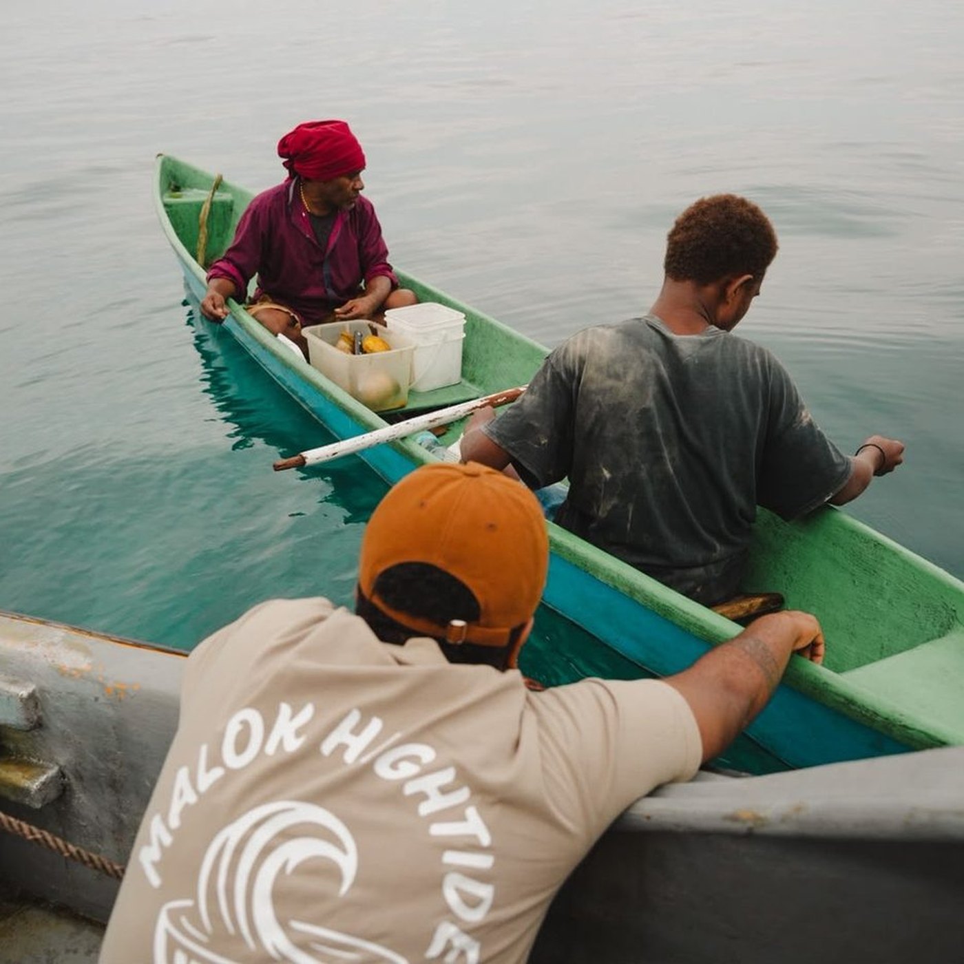 Men in a canoe on still water
