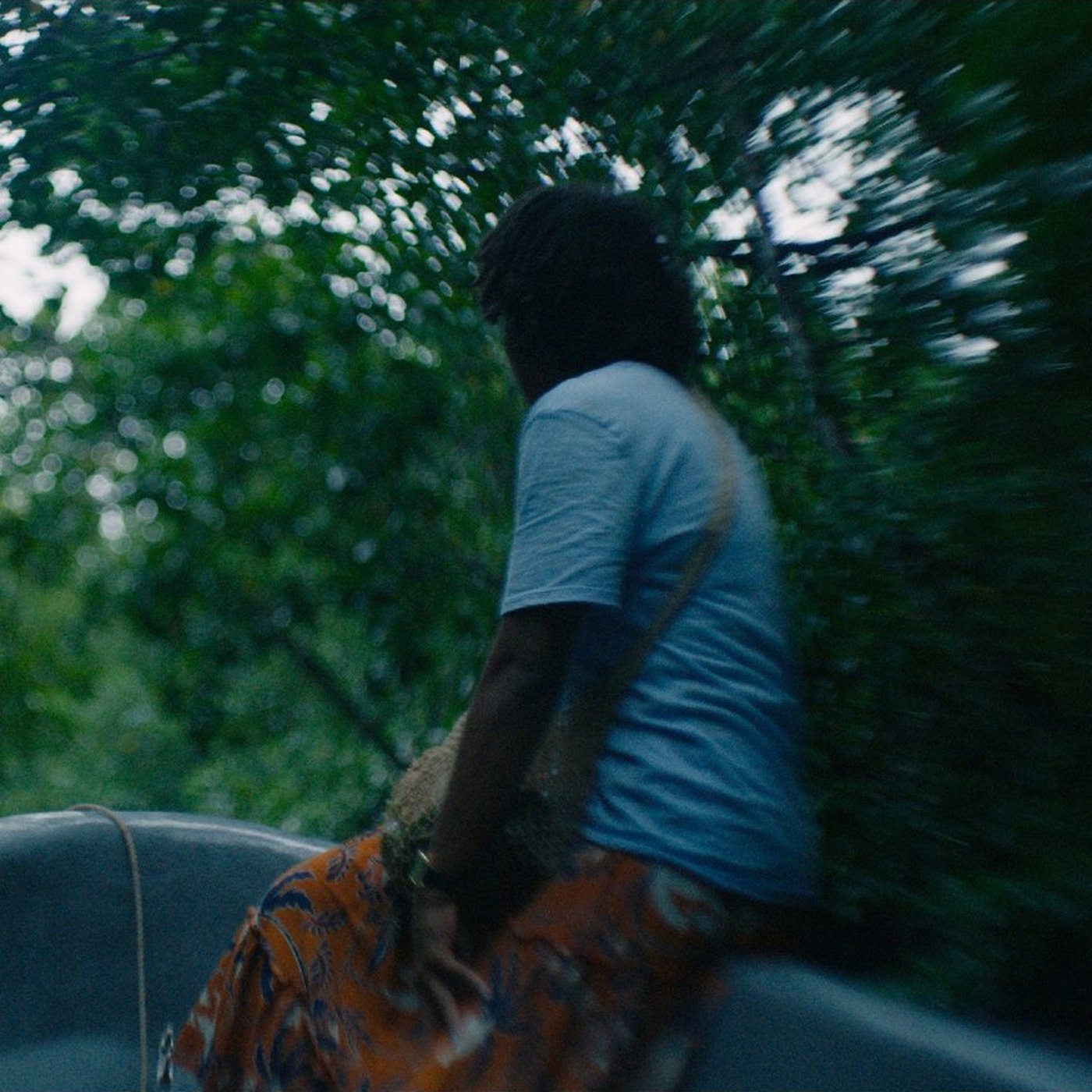 Cynthia Houniuhi in a boat under mangrove trees