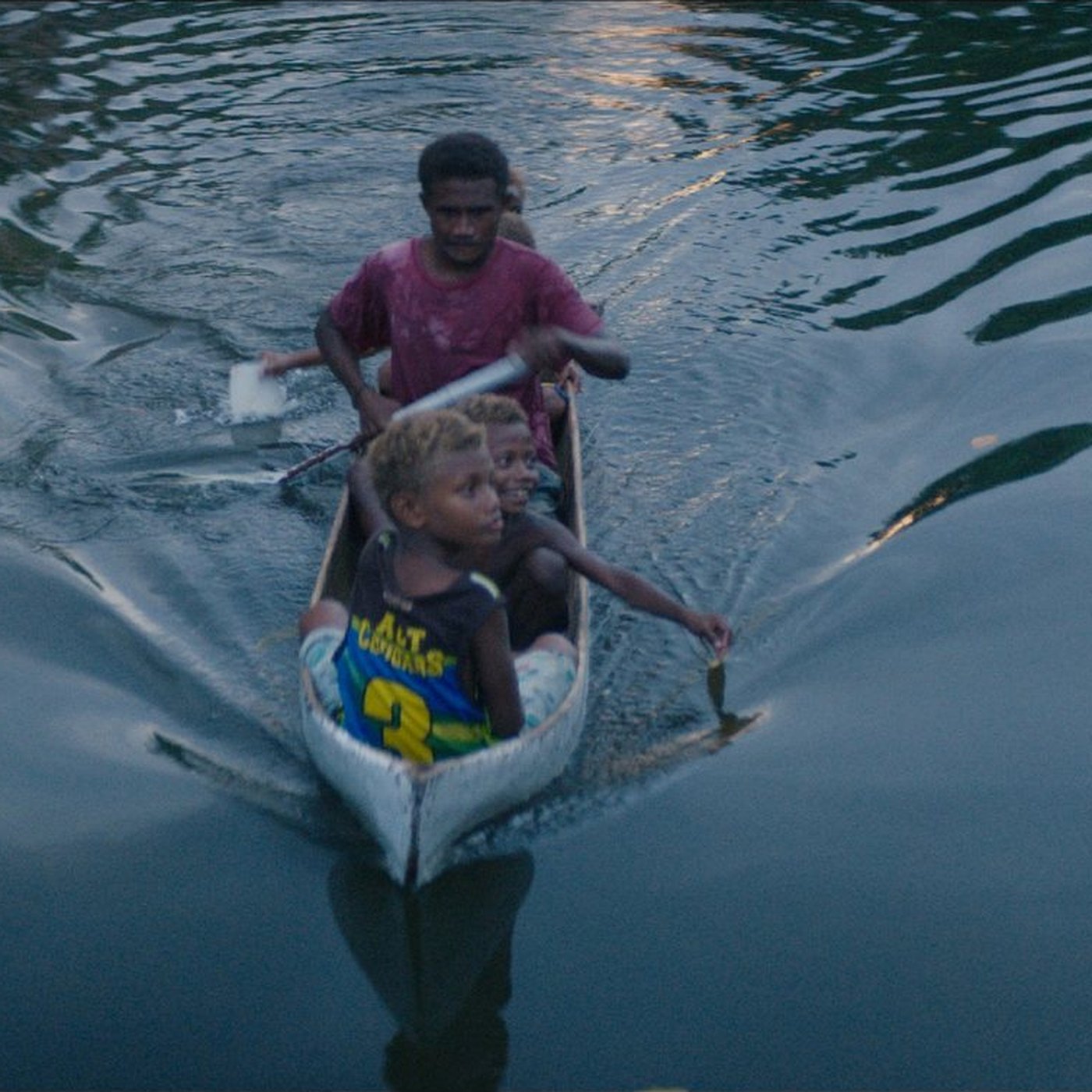 A family in a canoe on still water