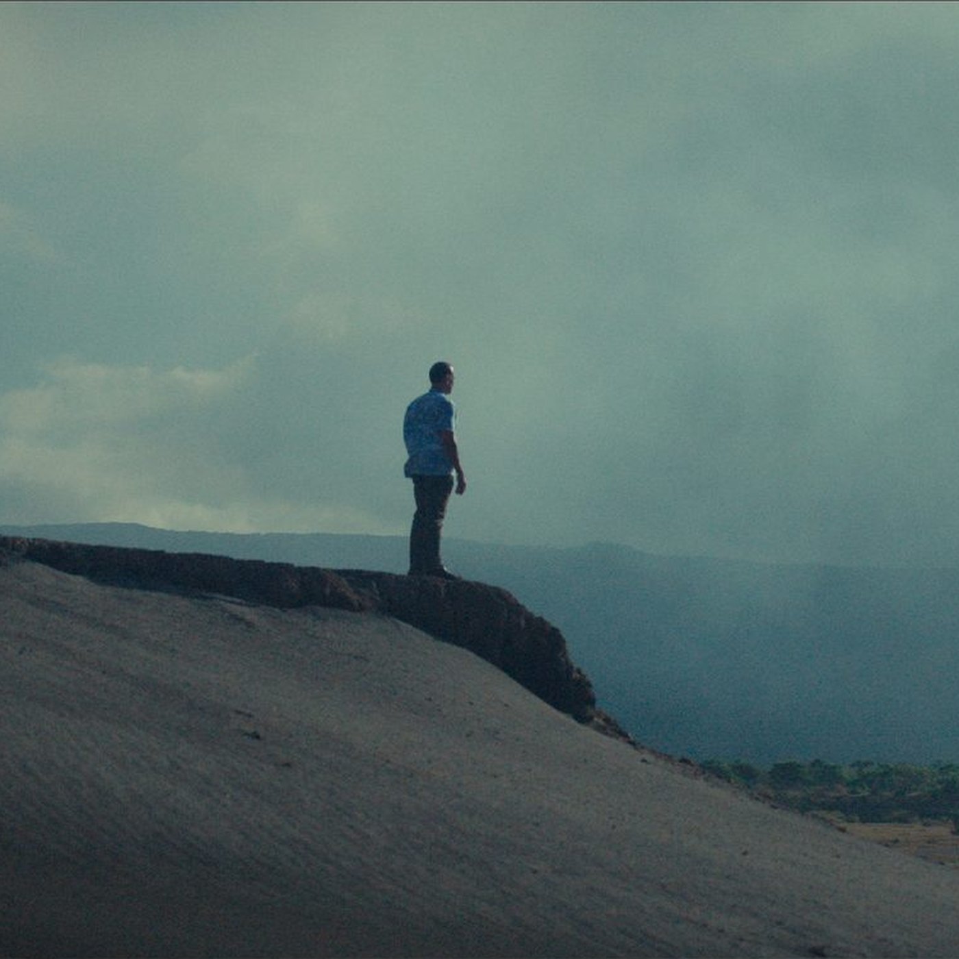 Ralph Regenvanu standing on a ridge